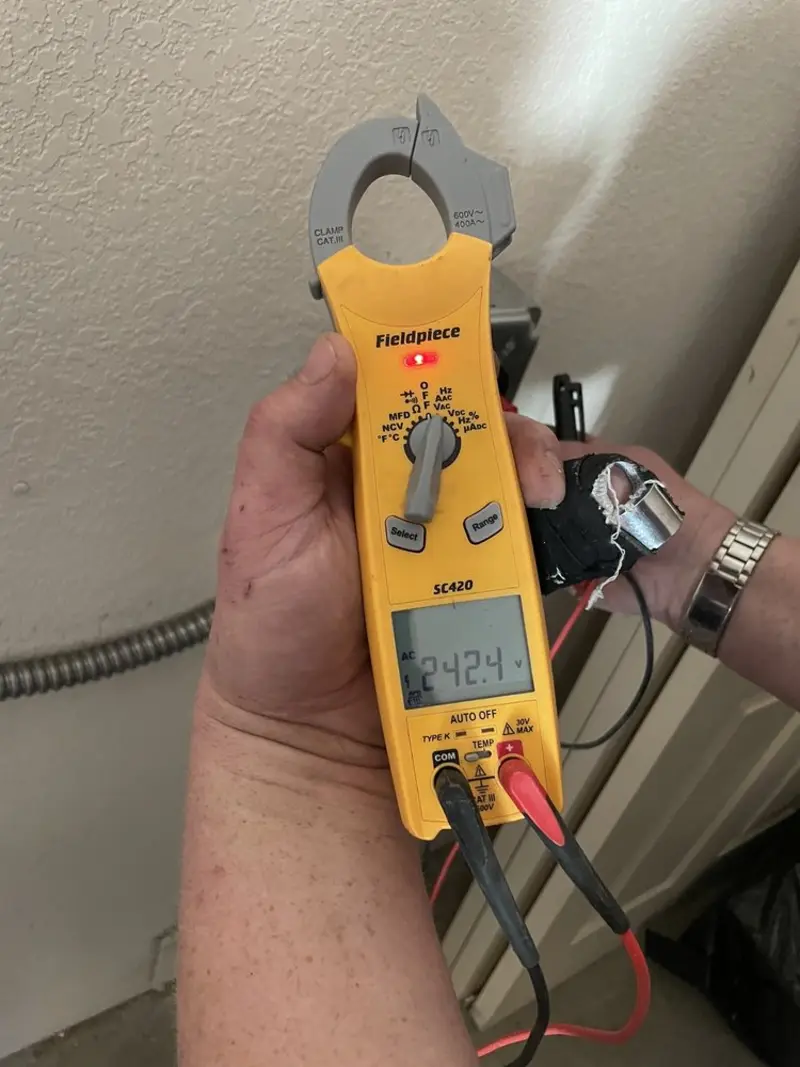 Voltage testing with clamp meter during Hot Tub / Pool Electrical Wiring in Altus